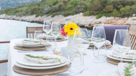 Enjoy a stylish dinner with a beautiful sea view aboard the Gulet Primadonna.